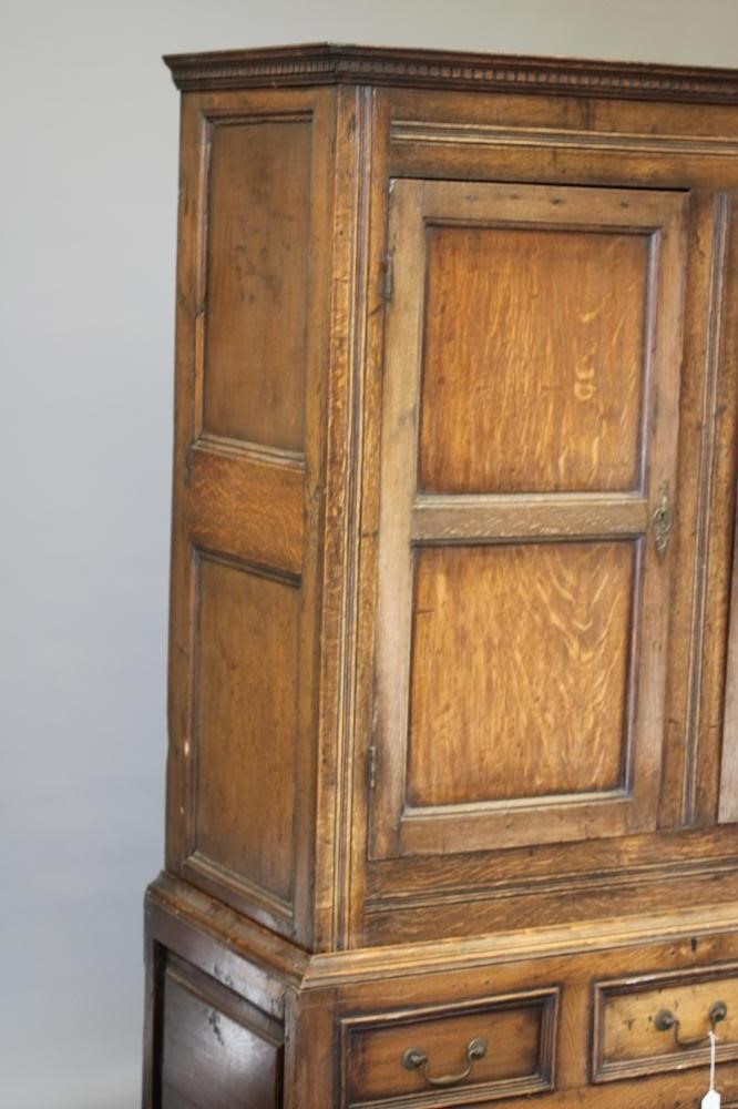 A JOINED OAK CLOTHES CUPBOARD Image