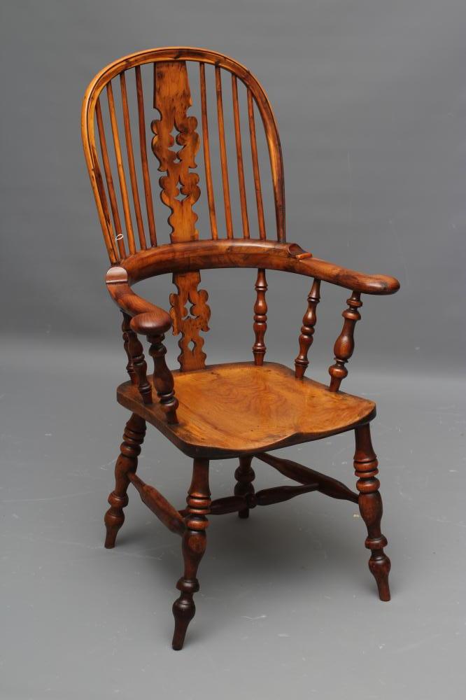 A YEW AND ELM WINDSOR ARMCHAIR Image