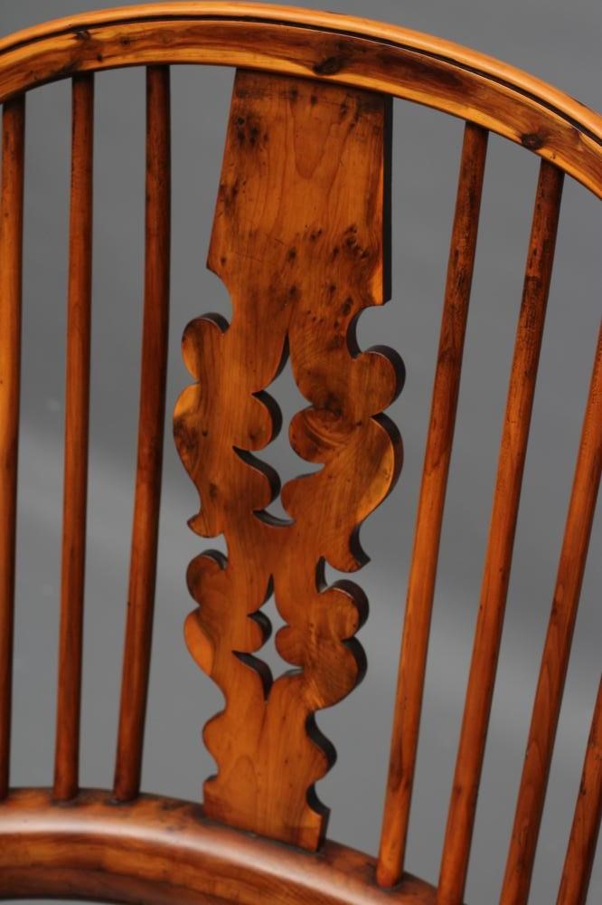 A YEW AND ELM WINDSOR ARMCHAIR Image
