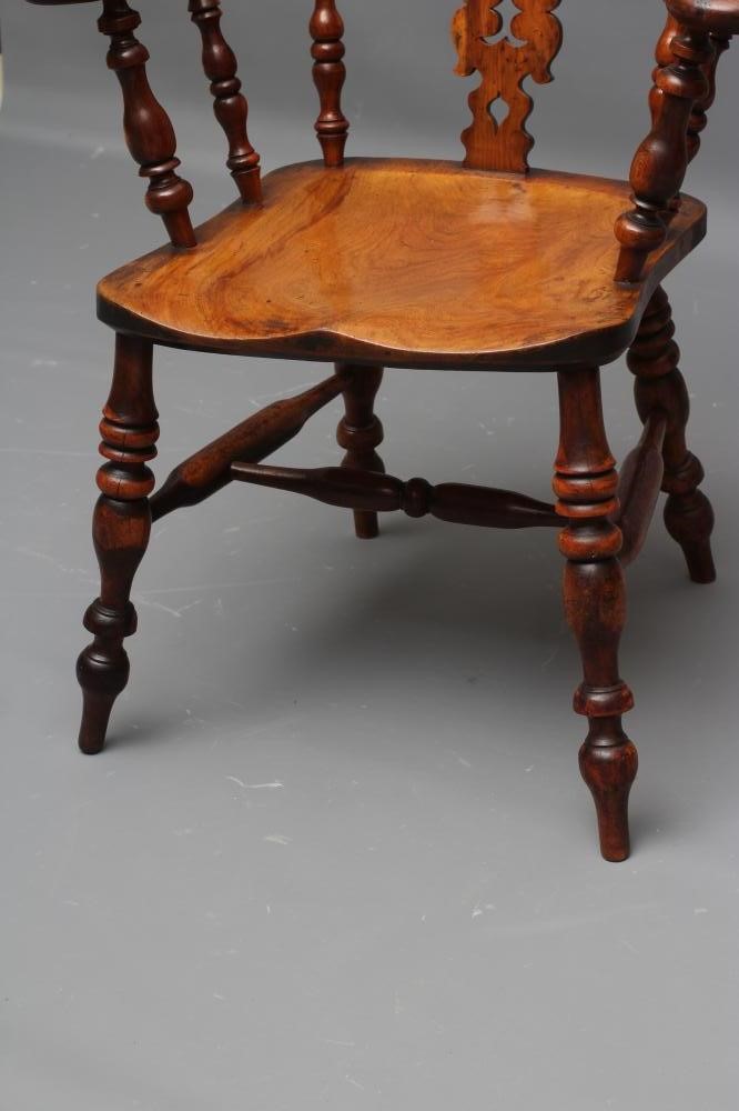 A YEW AND ELM WINDSOR ARMCHAIR Image