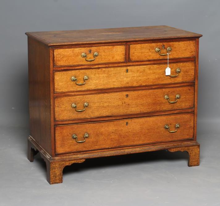 A GEORGIAN OAK AND MAHOGANY BANDED CHEST Image