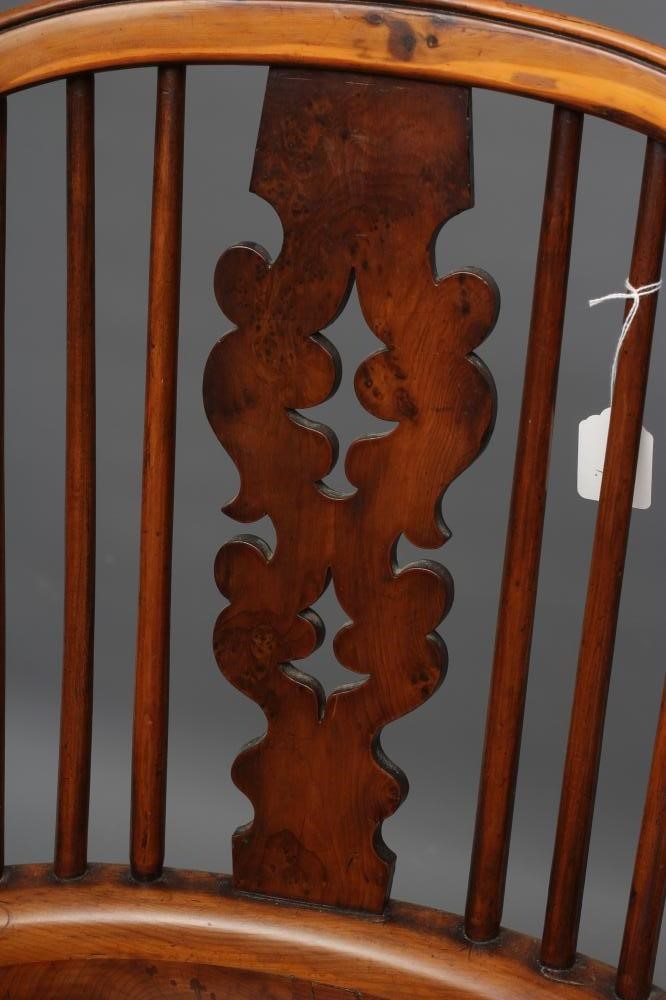 A YEW AND ELM WINDSOR ARMCHAIR Image