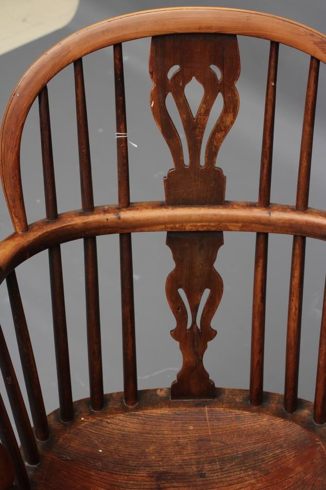 A YEW AND ELM WINDSOR ARMCHAIR Image