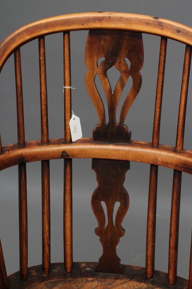 A YEW AND ELM WINDSOR ARMCHAIR Image