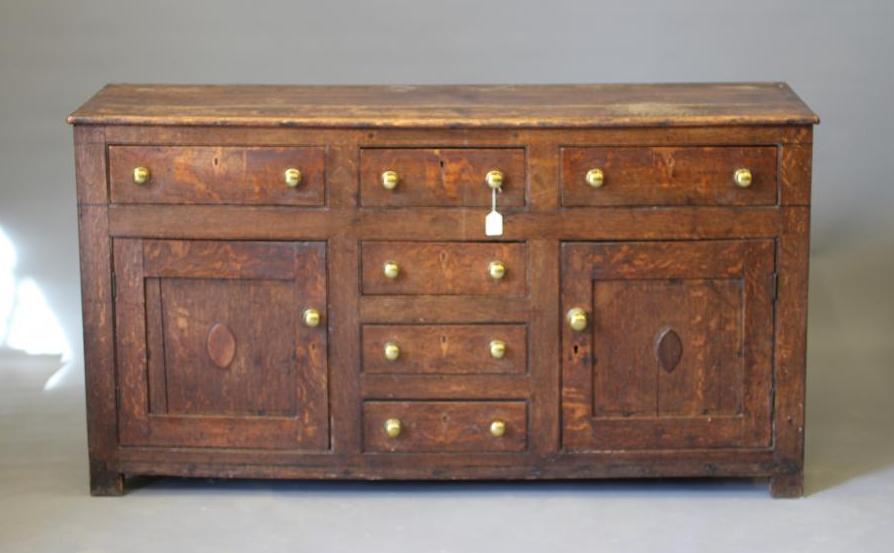 AN OAK ENCLOSED DRESSER Image