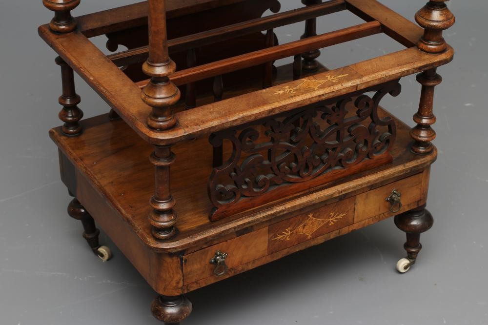 A VICTORIAN WALNUT CANTERBURY/WHATNOT of rounded oblong form with stringing and foliate marquetry Image