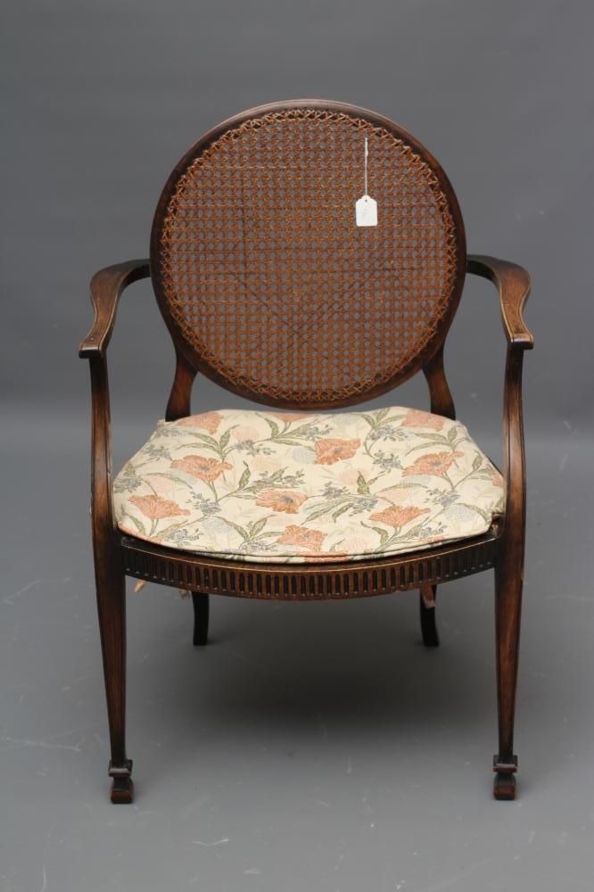 AN OAK FRAMED CANED ELBOW CHAIR of Georgian design Image