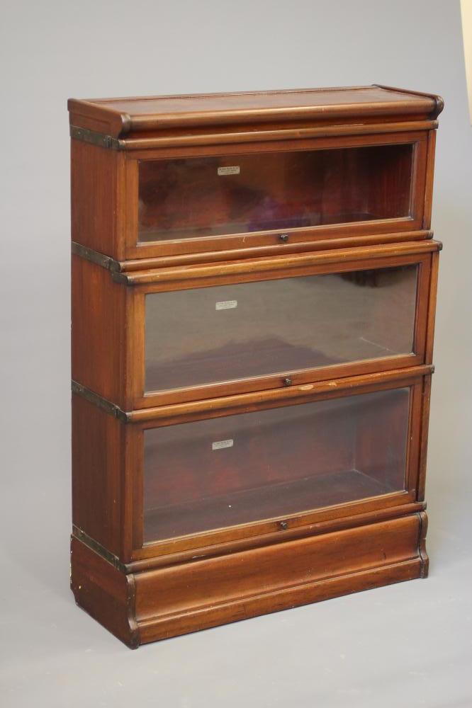 A PAIR OF VICTORIAN MAHOGANY GLOBE WERNICKE SECTIONAL BOOKCASES Image
