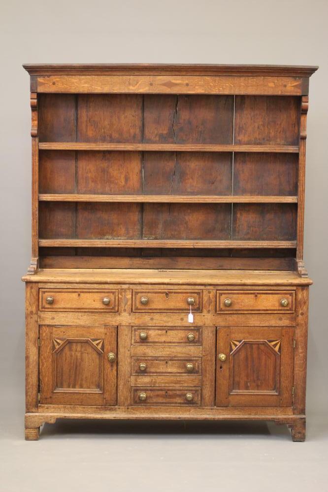 AN ANGLESEY OAK AND PARQUETRY DRESSER Image