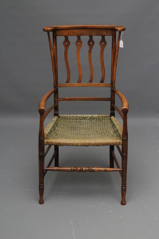 AN ARTS AND CRAFTS BEECH ELBOW CHAIR Image