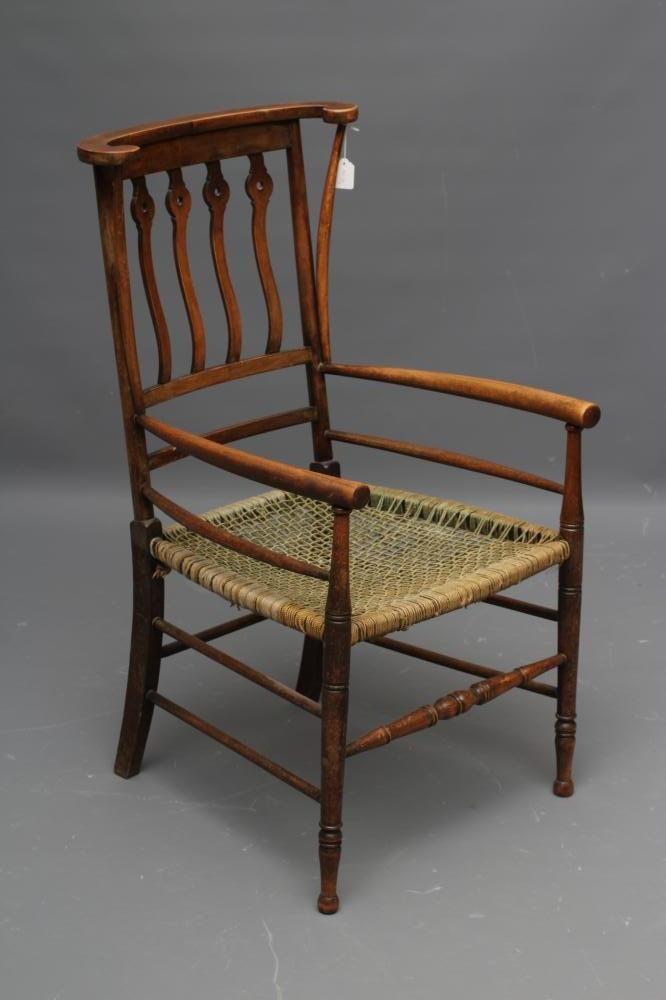 AN ARTS AND CRAFTS BEECH ELBOW CHAIR Image