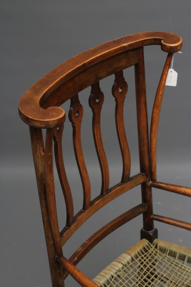 AN ARTS AND CRAFTS BEECH ELBOW CHAIR Image