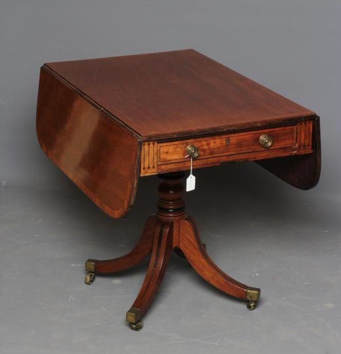 A REGENCY MAHOGANY PEMBROKE TABLE of rounded oblong form with stringing Image