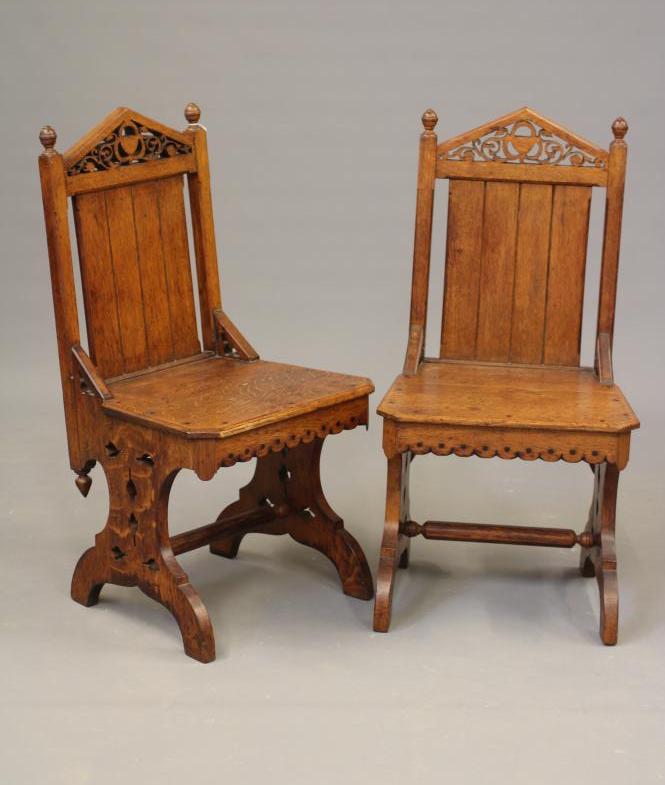 A PAIR OF VICTORIAN GOTHIC OAK AND EBONY INLAID HALL CHAIRS Image