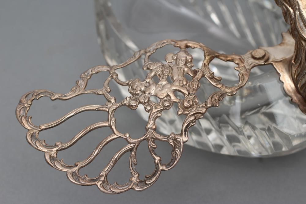 A SILVER MOUNTED CUT GLASS SWAN POSY HOLDER Image