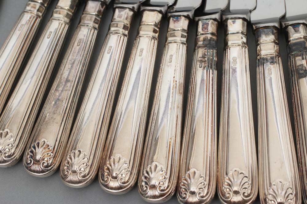 A SET OF TWELVE TABLE AND DESSERT KNIVES Image