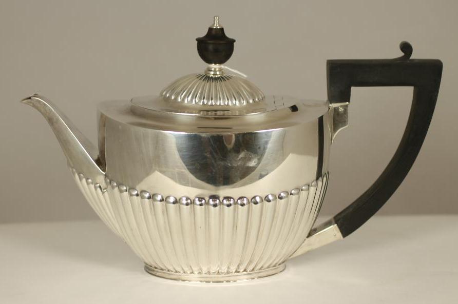 A SILVER TEAPOT Image