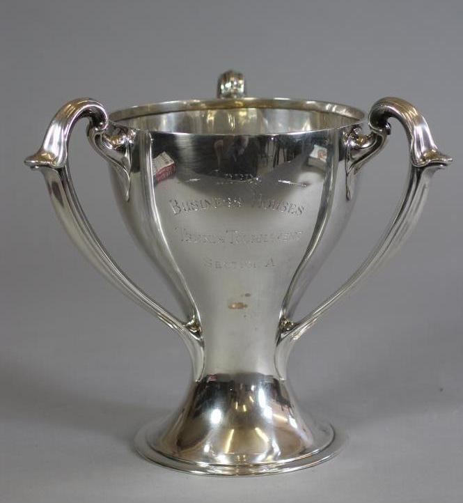 AN ARTS AND CRAFTS STYLE SILVER THREE HANDLED TROPHY CUP Image