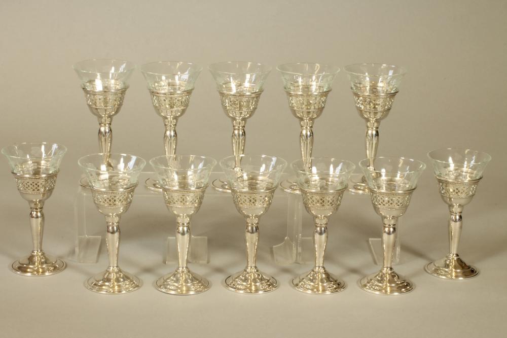A SET OF TWELVE SHERRY GLASSES Image