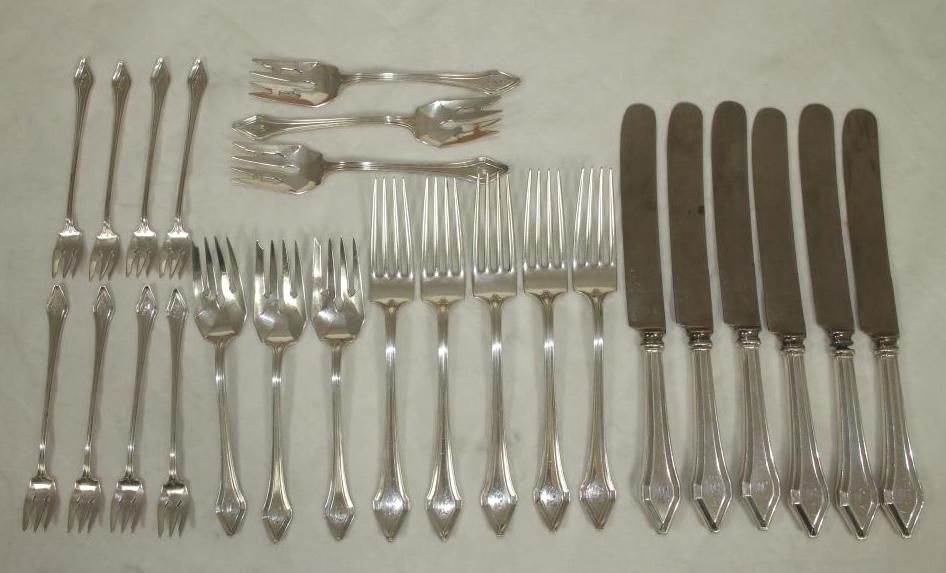 A SILVER PART TABLE SUITE Image