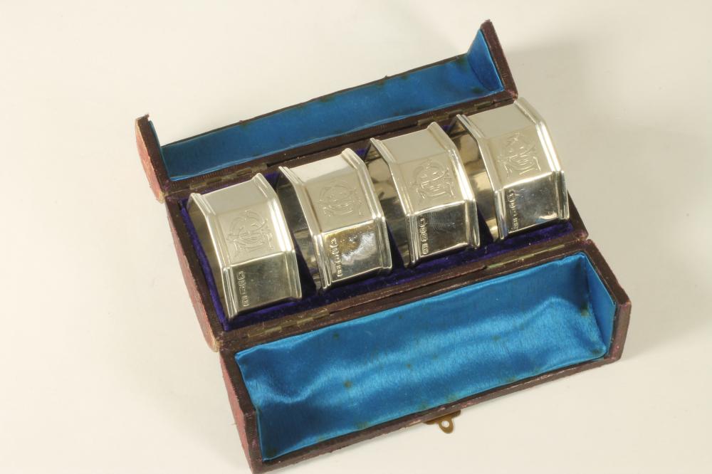 A SET OF FOUR LATE VICTORIAN SILVER NAPKIN RINGS Image