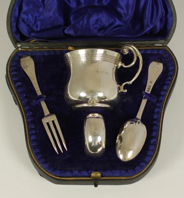 AN EDWARDIAN SILVER FOUR PIECE CHRISTENING SET Image