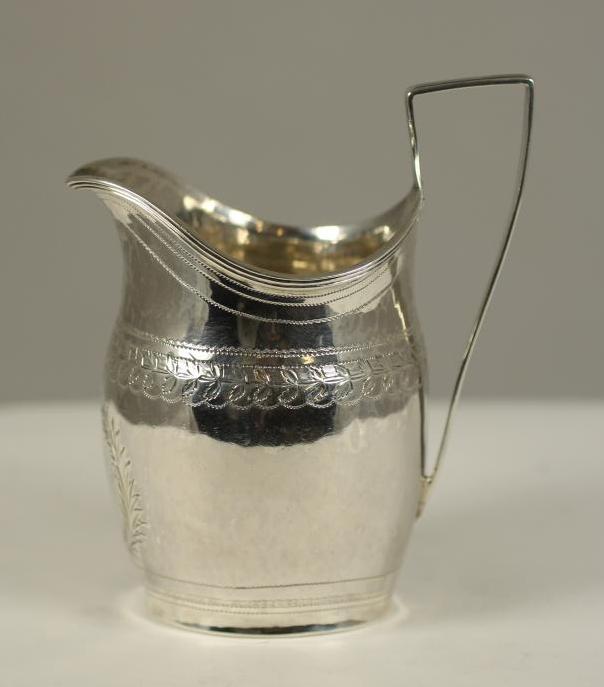 A GEORGE III SILVER MILK JUG Image