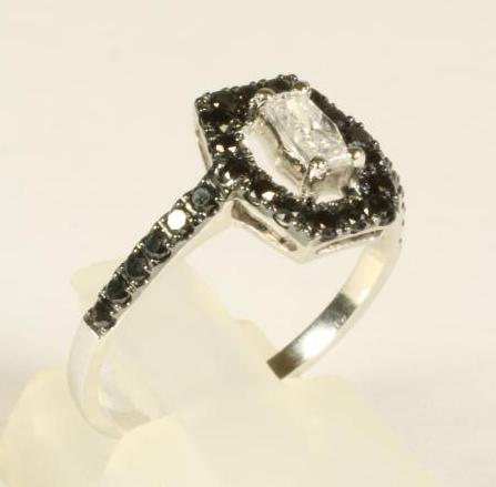 A BLACK AND WHITE DIAMOND RING Image