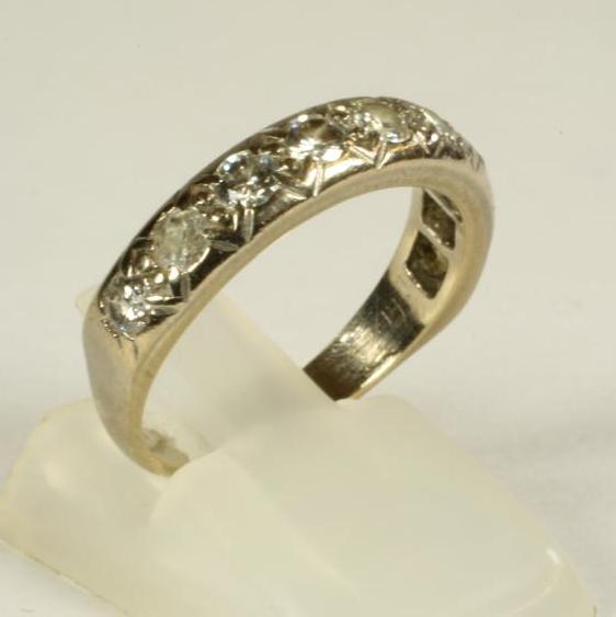 A NINE STONE DIAMOND HALF HOOP ETERNITY RING Image