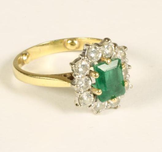 AN EMERALD AND DIAMOND DRESS RING Image
