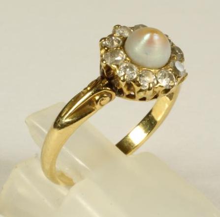 A PEARL AND DIAMOND RING Image