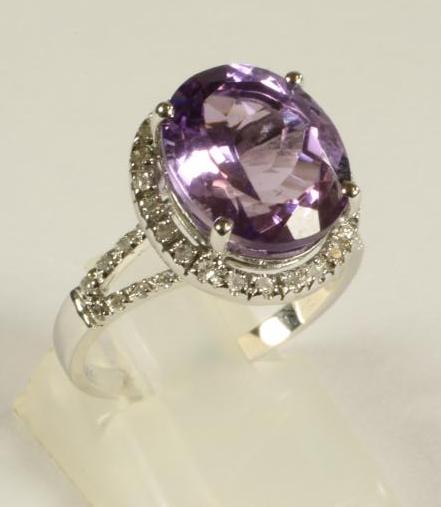 AN AMETHYST AND DIAMOND DRESS RING Image