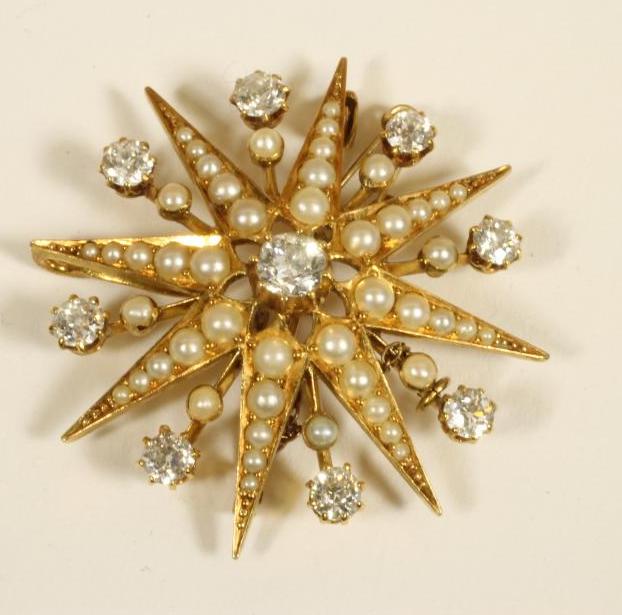 A DIAMOND AND PEARL STAR BROOCH/PENDANT Image