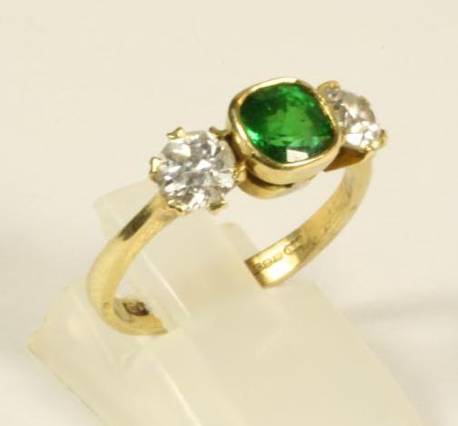 AN EMERALD AND DIAMOND RING Image