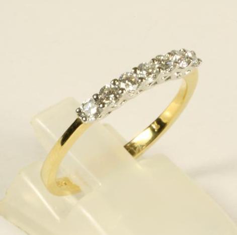A SEVEN STONE DIAMOND HALF HOOP ETERNITY RING Image