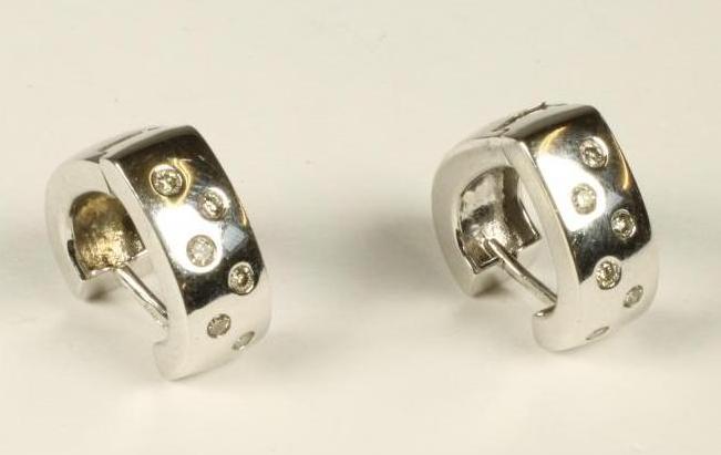 A MODERN PAIR OF 9KT WHITE GOLD EAR HOOPS Image