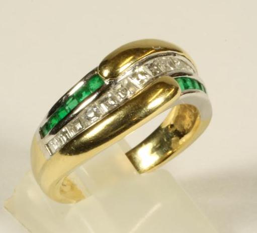 AN EMERALD AND DIAMOND HALF HOOP RING Image