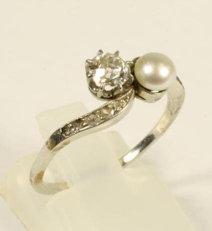 A VICTORIAN PEARL AND DIAMOND CROSSOVER RING Image