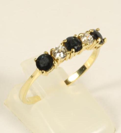 A FIVE STONE SAPPHIRE AND DIAMOND HALF HOOP RING Image