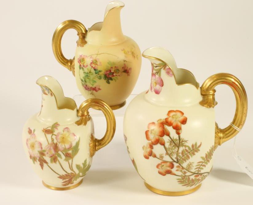 A COLLECTION OF THREE ROYAL WORCESTER CHINA JUGS Image