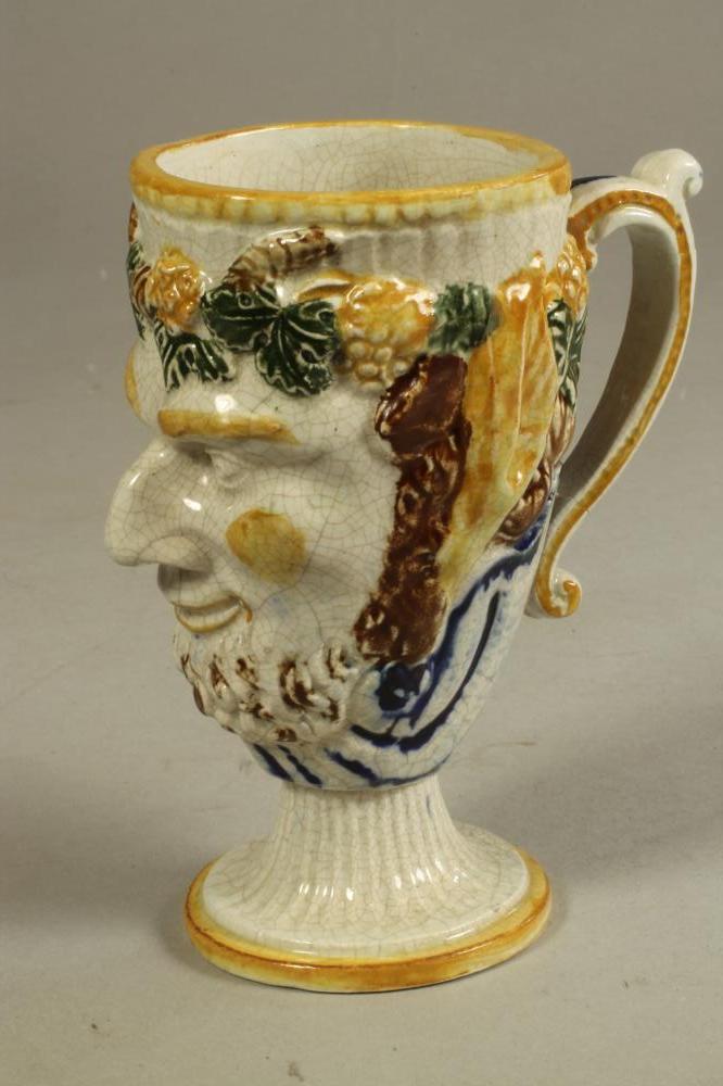 A STAFFORDSHIRE PORCELANEOUS BACCHUS MASK FROG MUG Image