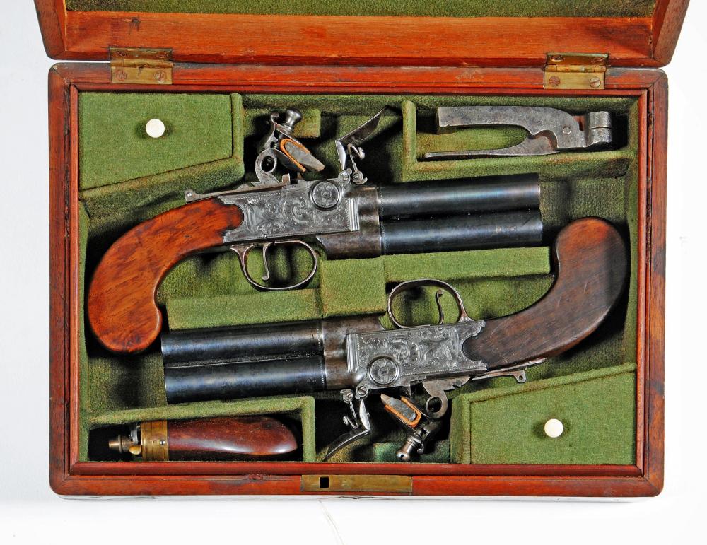A CASED PAIR OF DOUBLE BARRELLED OVER & UNDER FLINTLOCK PISTOLS Image