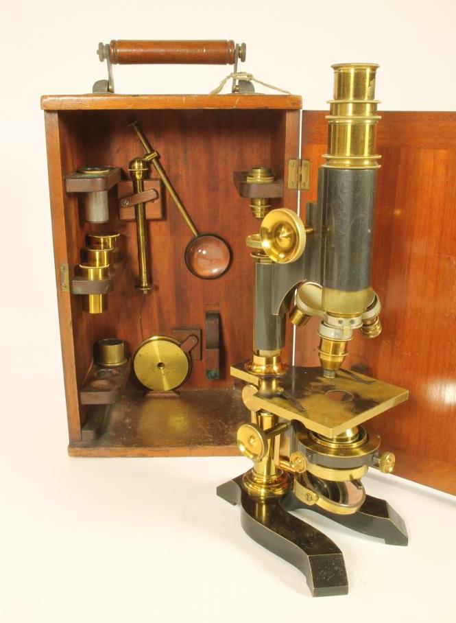 A 19TH CENTURY BRASS AND BLACK LACQUERED MONOCULAR MICROSCOPE signed Reynolds & Branson Image