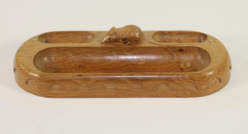 AN OAK PEN TRAY by Robert "Mouseman" Thompson of rounded oblong form with half penny moulded edge Image