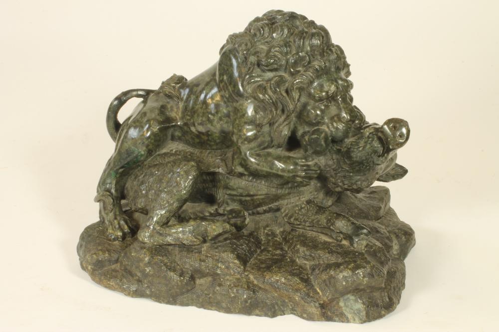 A CARVED GREEN GRANITE GROUP Image