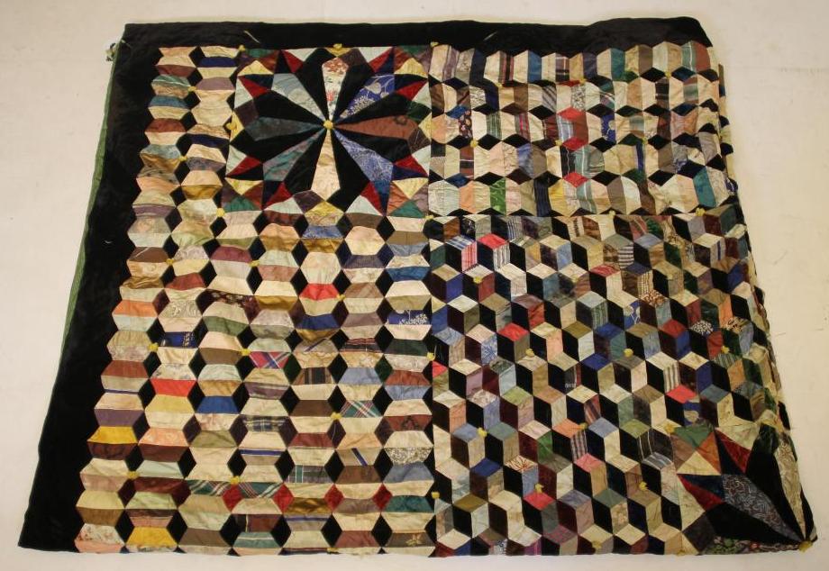 A MID VICTORIAN SILK AND VELVET PATCHWORK QUILT Image