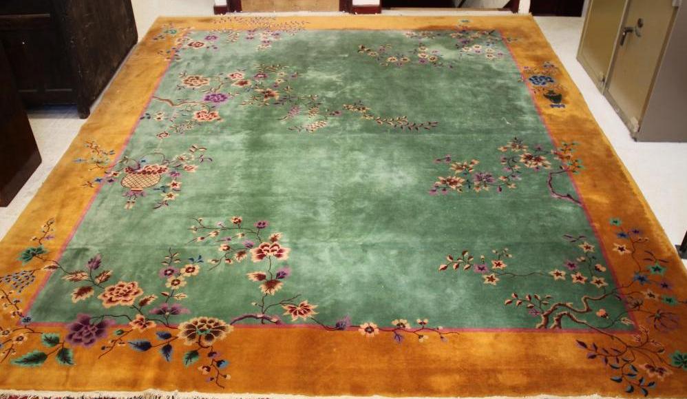 A CHINESE WASHED AND FRINGED RUG Image