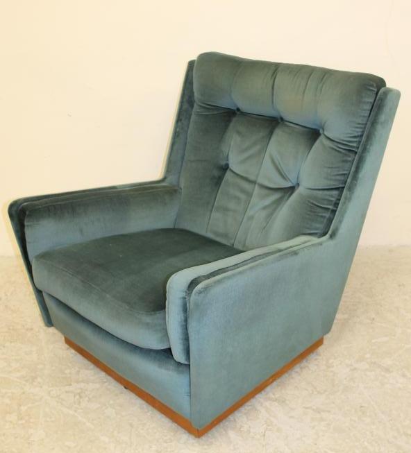A TEAK FRAMED LOUNGE SWIVEL ARM CHAIR Image