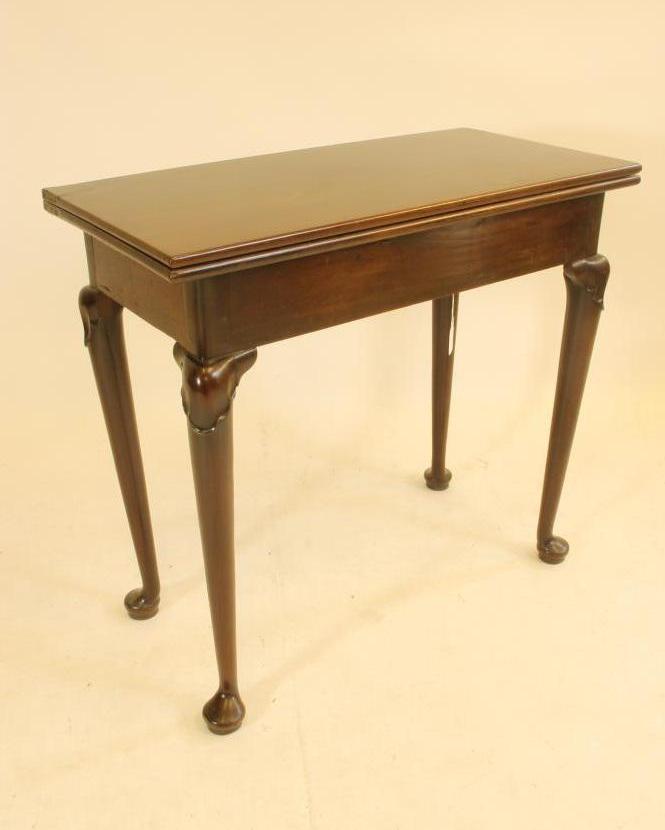 A GEORGIAN MAHOGANY FOLDING TEA TABLE Image