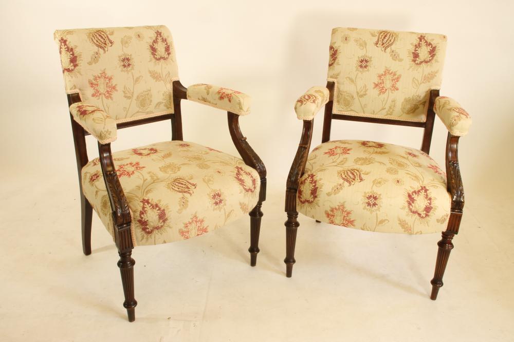 A PAIR OF LATE VICTORIAN MAHOGANY OPEN ARMCHAIRS upholstered in a cream and red floral weave Image